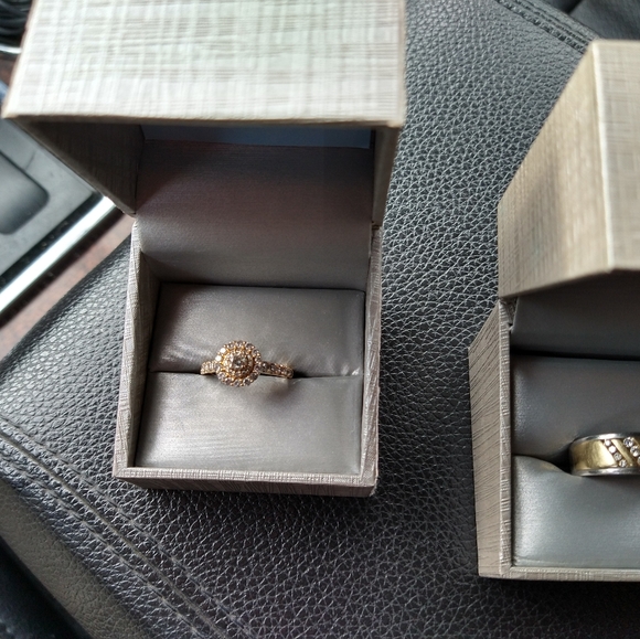 An engagement ring and man's wedding band . - Picture 9 of 10